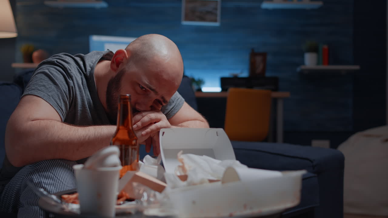 Depressed man crying feeling loneliness, chronic fatigue