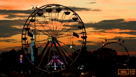 state fair ferris wheel at sunset time lapse