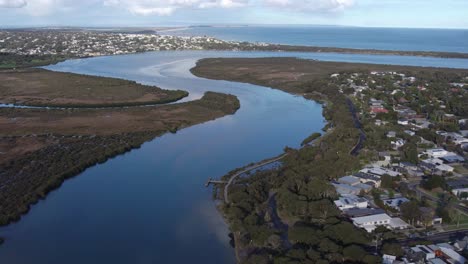 aerial footage near the mouth of the barwon river near barwon heads and ocean grove, victoria, australia