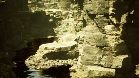 natural rock formations and still water reflect serene wilderness landscape
