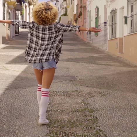 model walks the mediterranean street along