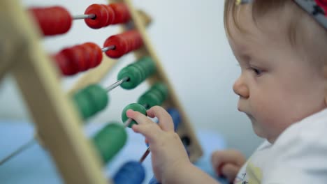 child plays with a multi-colored toy 5