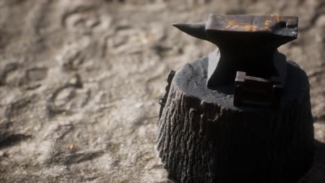 old anvil attached to a stump