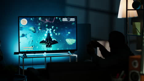skilled gamer having fun winning video games on lcd smart tv setup