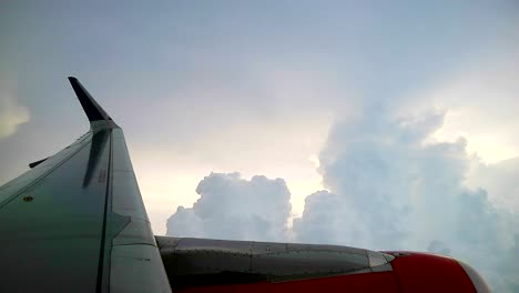 dramatic clouds before sunset, view from airplane windows