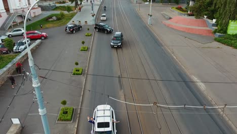 classic wedding car procession. car wedding procession drives through city