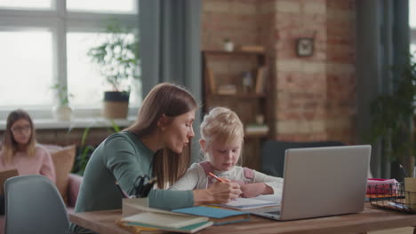 mother helping daughter with homework
