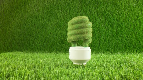 Eco-light-bulb-in-green-grass.-Eco-concept-background