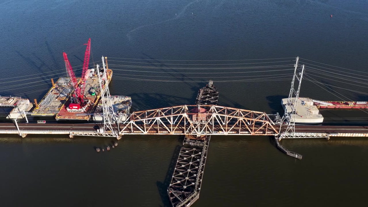 Sideways Aerial View of River Draw Bridge Construction Over the Raritan River in Perth Amboy New Jersey