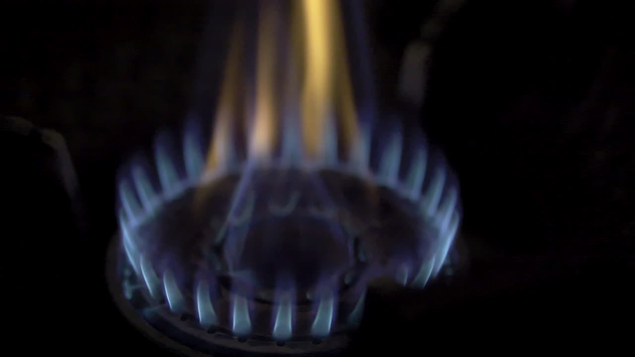 Culinary Art in Slow Motion Blue Flames from Gas Stove Adding Intense Flavor to High-Heat Cooking