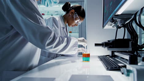scientists conducting experiment in modern laboratory