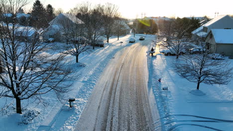 homes in american neighborhood after fresh winter snow