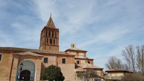 Old-church-in-Spanish-village-with-open-square