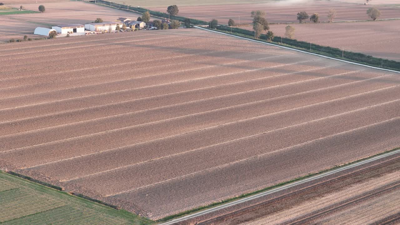 Aerial View Of Mechanized Soil Preparation In Po Valley Agricultural Field Near Piacenza, Italy