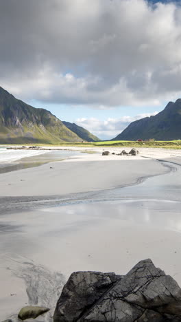 ramberg beach in the lofoten islands, norway in vertical