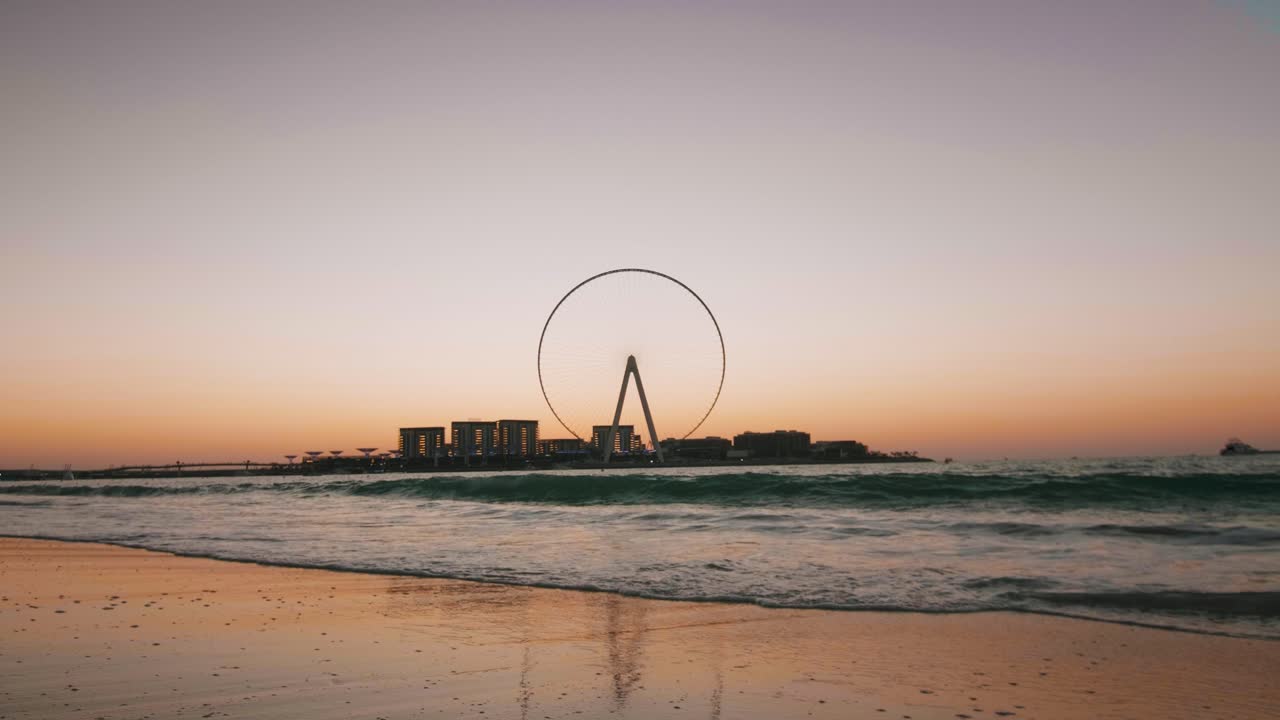 Sunset over Ferris Wheel Pier, Shore Waves, Dubai Marina