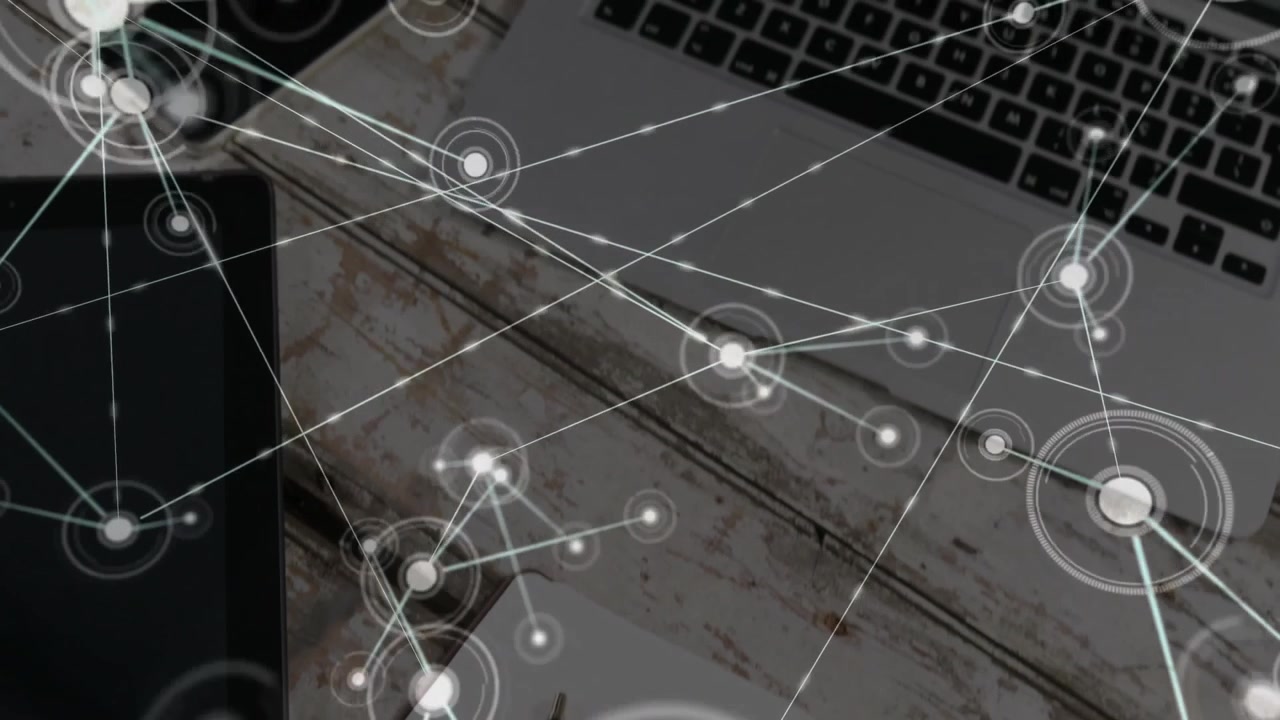 Flat design network overlay spreading across rustic desk, connecting tablet, laptop, notepad