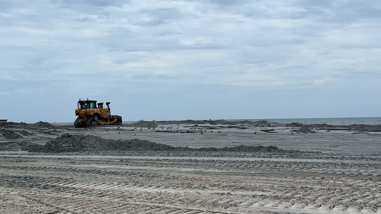 Bulldozer on the beach during construction