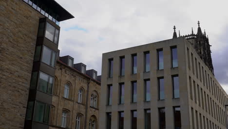 modern minimalistic buildings in front of a church