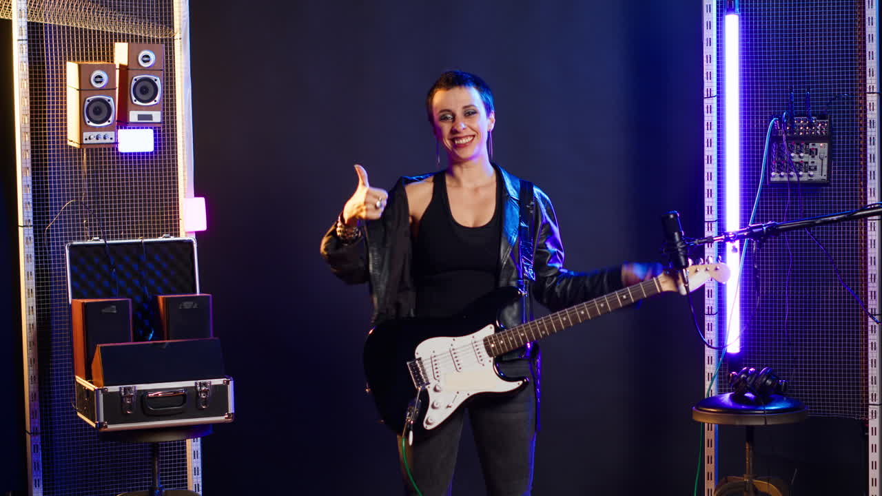 Woman playing electric guitar on stage