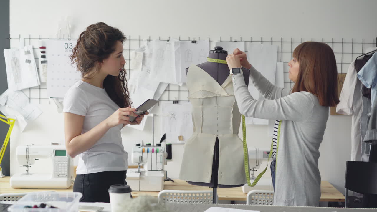 Fashion Designers Working in Studio