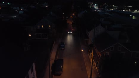 car driving on dark city alley street