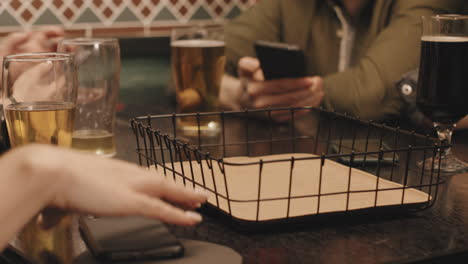 close up of smartphones in metal container