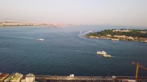 boats sailing in bosphorus strait at sunset, istanbul