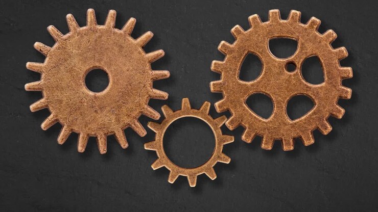 old gearwheels working in harmony and cooperation