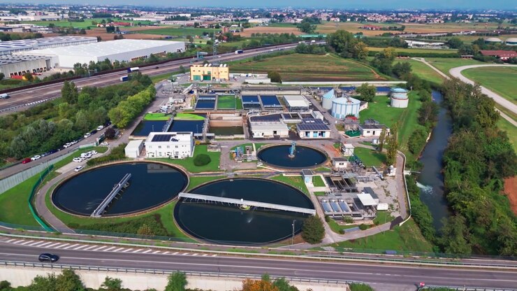 Modern wastewater treatment plant from above. Aerial view of sewage purification tanks for water recycling and sustainable resource management