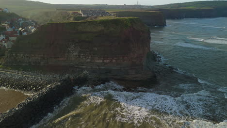 establishing drone shot of staithes cliff north yorkshire coast uk