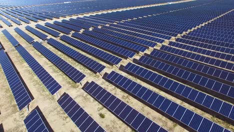 a beautiful aerial over a solar power farm in the mojave desert of california 1