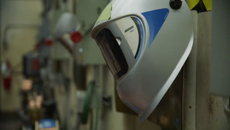 Welding-mask-on-the-wall-in-a-metal-shop