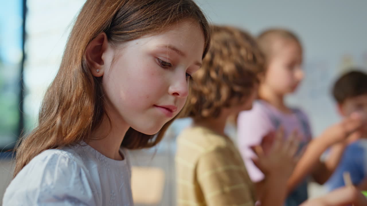 Pupils enjoy creativity art class creating colorful crafts closeup. School kids