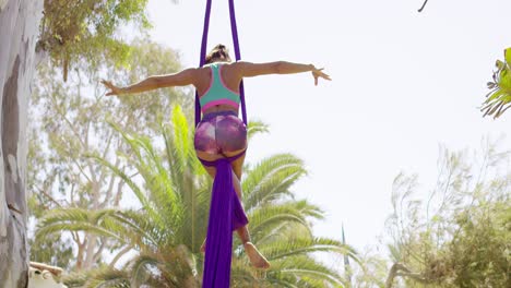 agile supple gymnast performing an acrobatic dance