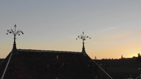 Architectural-and-decorative-details-on-roof-of-Chateau-Angelus-winery-at-dusk,-Saint-Emilion-in-France