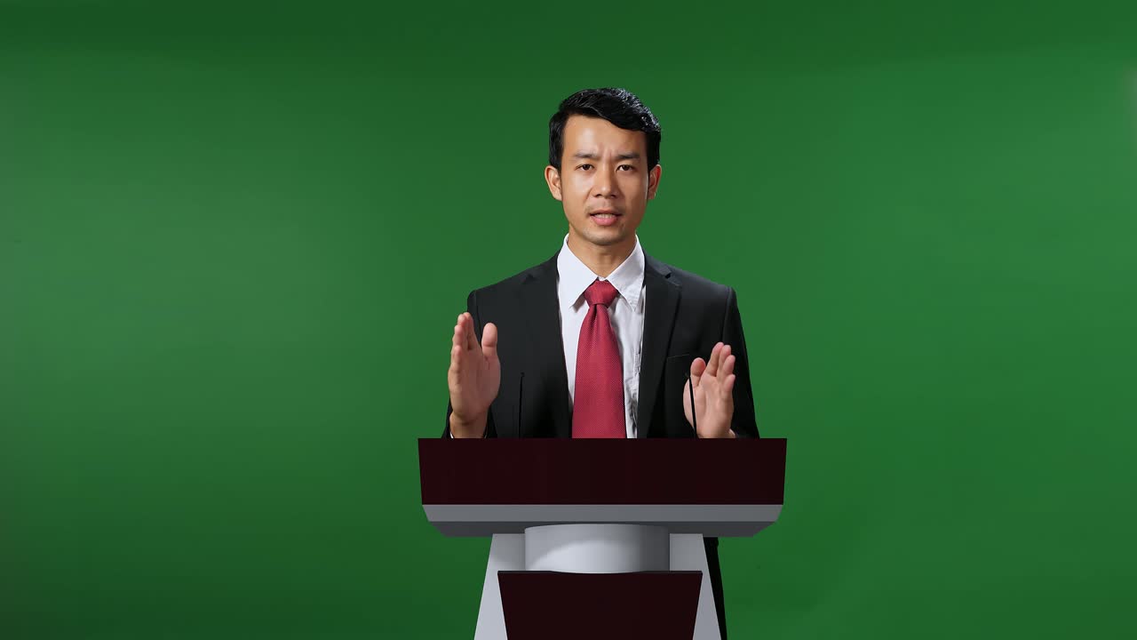 Asian Portrait Of Organization Representative Speaking At A Press Conference In Government With Mock Up Green Screen, Chroma Key