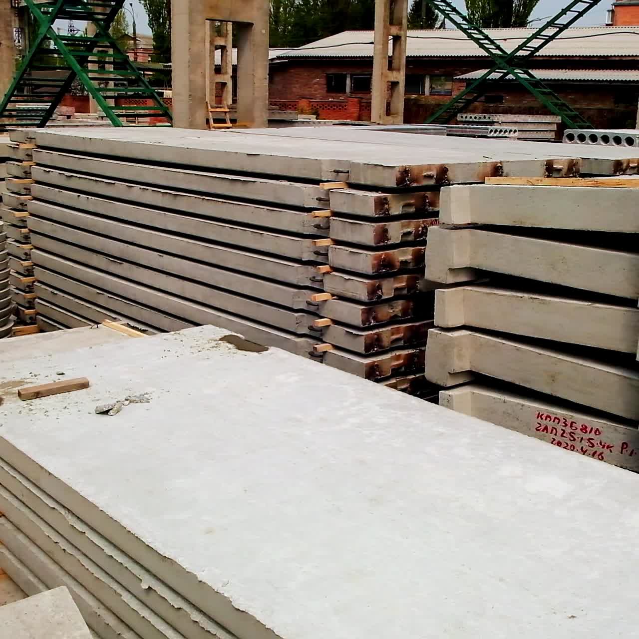 Various construction materials produced from armored concrete. Cement items for building placed outside in the plant zone