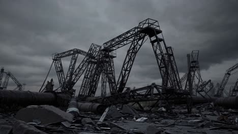 destroyed industrial landscape showing decaying infrastructure under dark cloudy sky, featuring broken cranes, debris, and pipelines, evoking a sense of abandonment and environmental decay