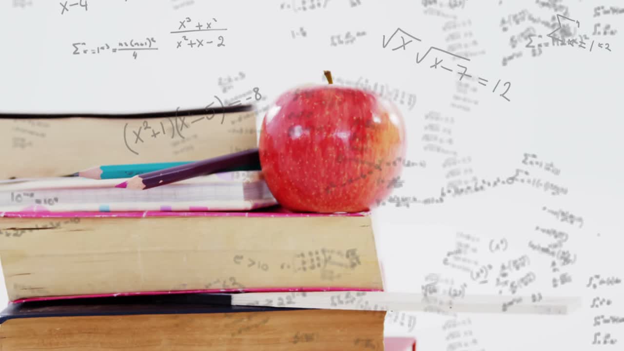 Mathematical equations moving against stack of books and apple
