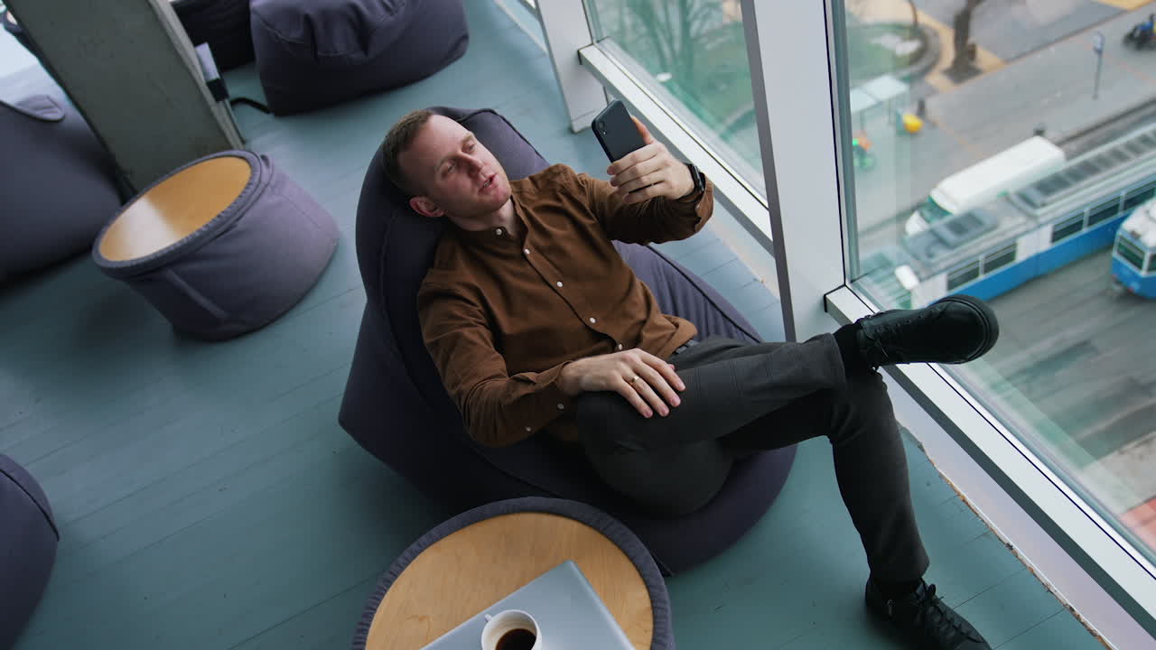 Happy businessman using mobile phone