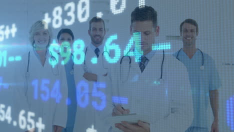 stock market data animation over medical professionals in lab coats