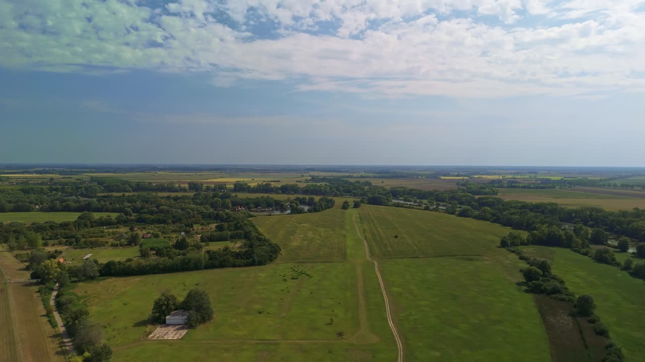 Green fields and forests along the Bodrog backwater near Sárospatak on a sunny autumn day in Hungary