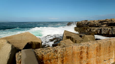 crashing waves hit rugged coastline