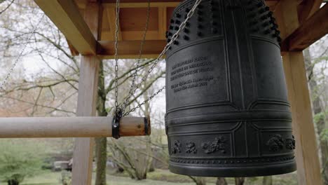 japanese peace bell in hasselt japanese garden, belgium, medium shot