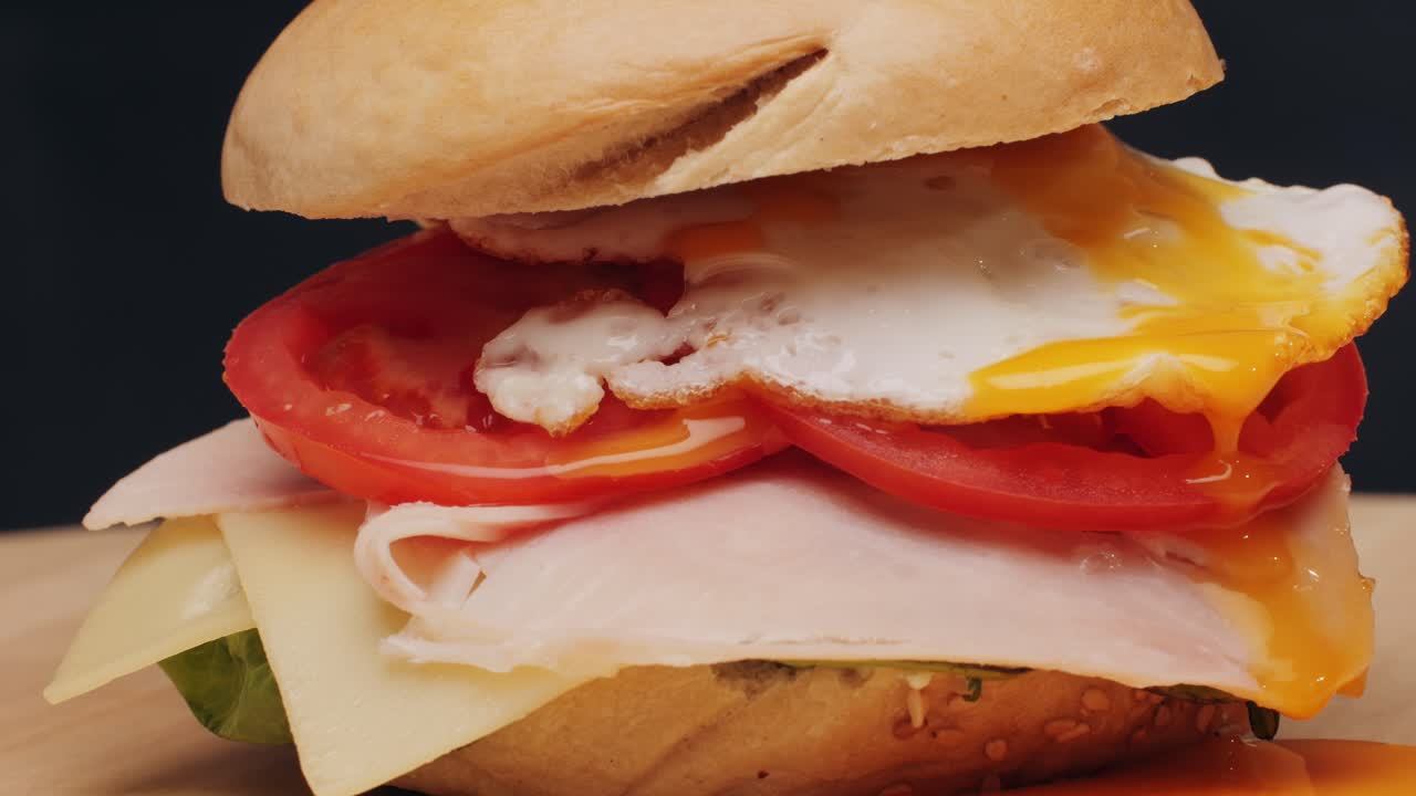 Bagel sandwich brunch, lunch plate of a bagel with smoked salmon and cream cheese and ham, close up morning cafe menu.