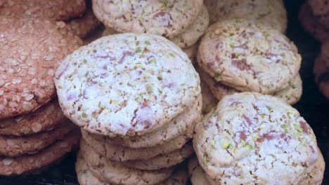 close up of stacks of chocolate chip pistachio cookies