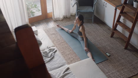 healthy-asian-woman-exercising-at-home-in-living-room-stretching-flexible-body-enjoying-healthy-fitness-lifestyle-practicing-warm-up-exercise