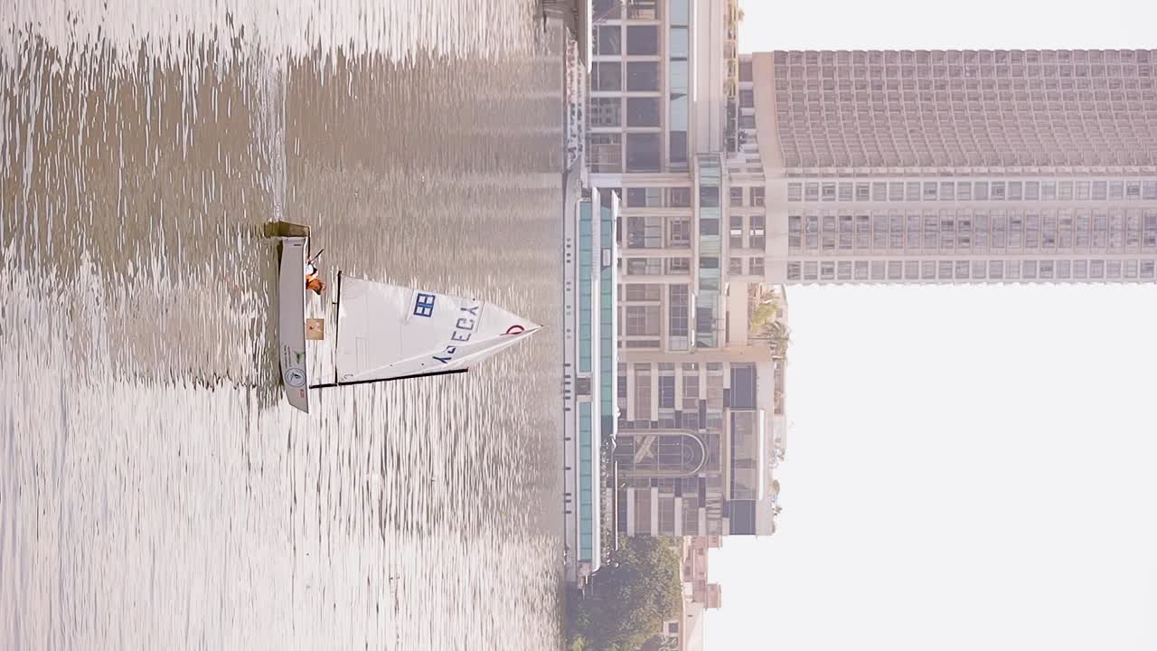 people enjoying their time by paddling and boating in the river vertical video