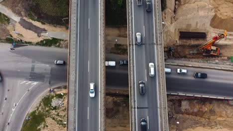 Static-aerial-shot-of-A1-highway-in-Kaunas-in-multi-level-intersection-with-a-road-beneath-the-highway